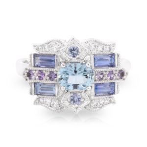 18ct White Gold Radiant Cut Aquamarine with Baguette Cut Sapphire, Purple Sapphires and Diamonds. TDW 0.10ct