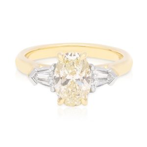 18ct Yellow and White Gold Oval M Colour 1.51ct centre Diamond flanked by pair of Diamond Bullets Trilogy style Engagement Ring